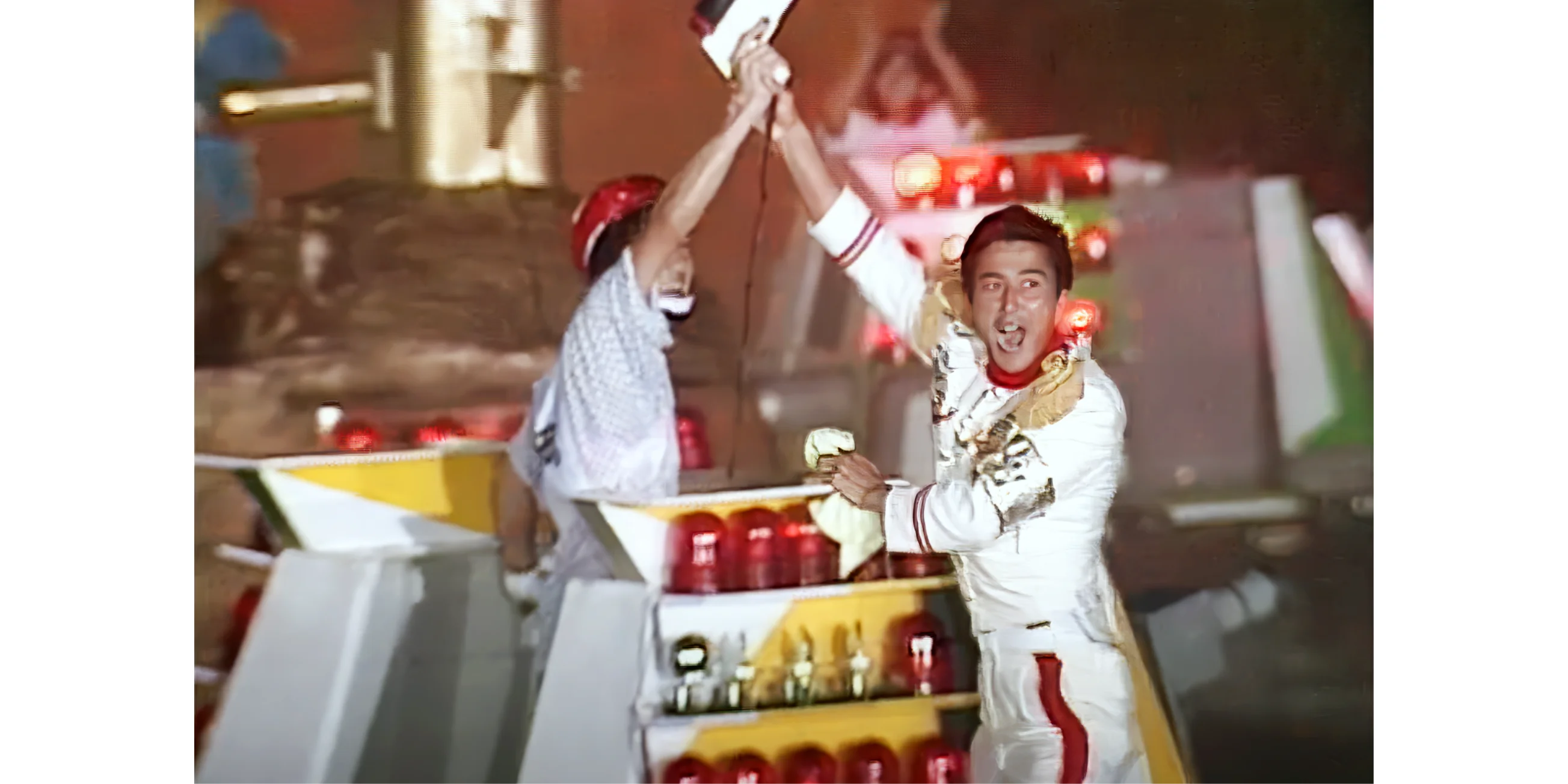 General Tani holds a contestant's arm in the air moments after he's beaten Takeshi - Takeshi's Castle Winners